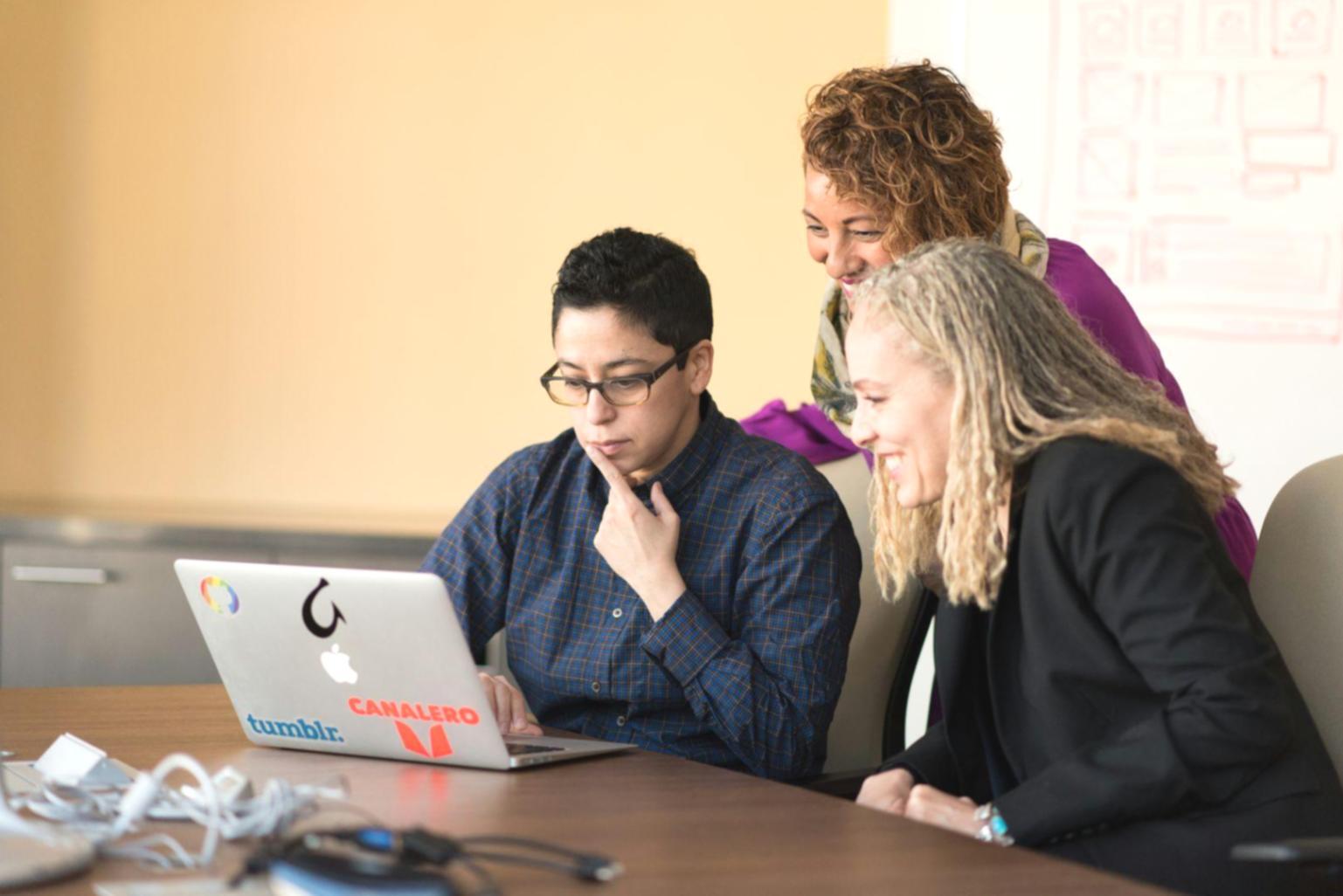 Finance professionals collaborating on cost analysis